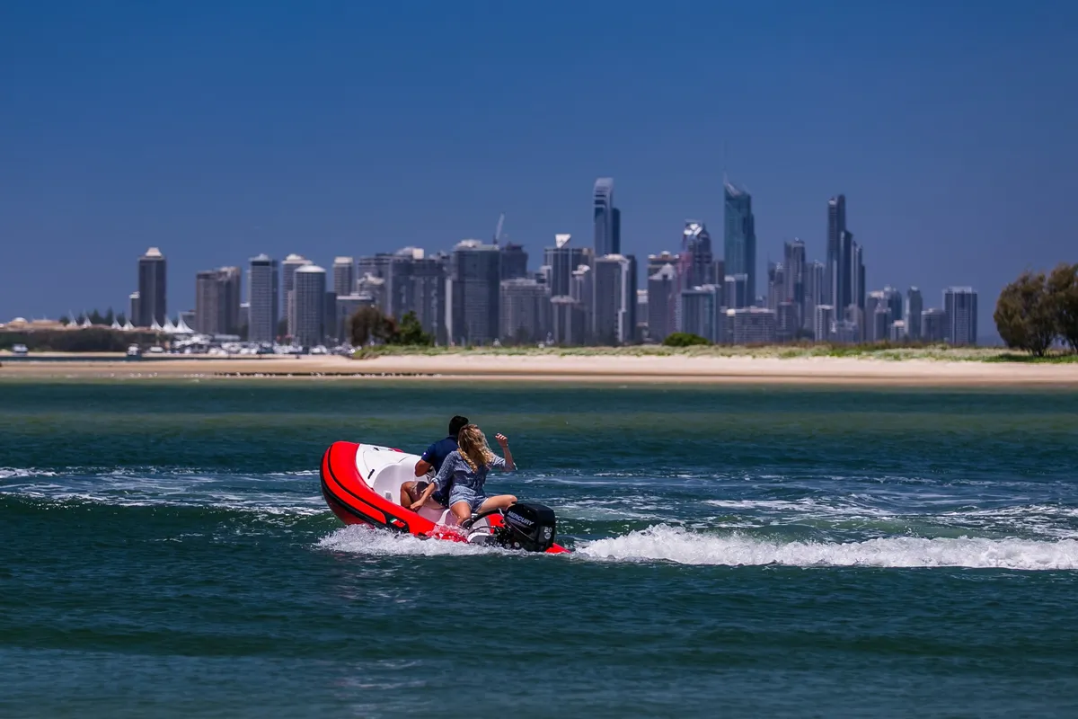 AB Inflatables AB Rider: Rubber boat cruising against a city skyline