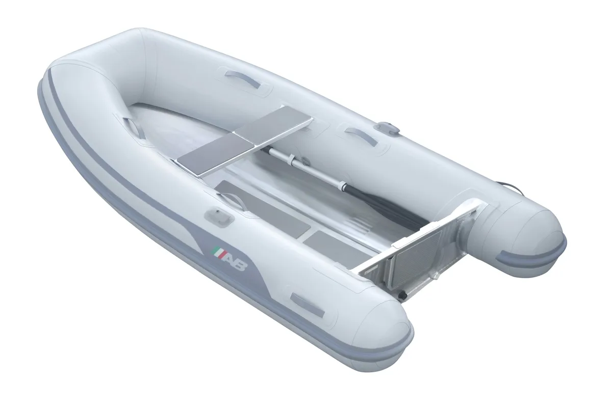 AB Inflatables Lammina 9 UL: Inflatable boat with a paddle on a white background