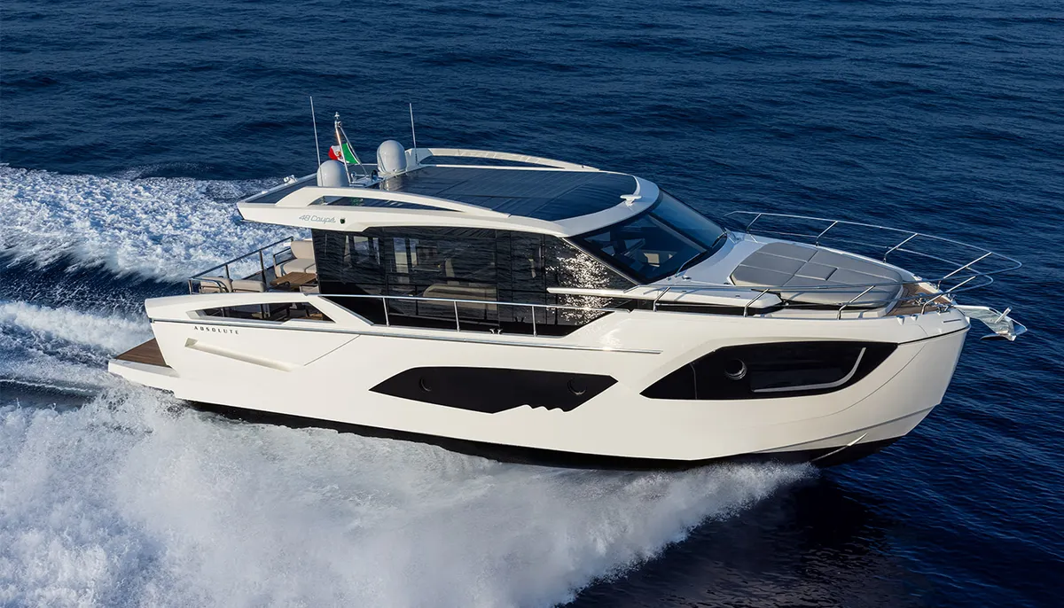 Absolute Yachts 48 Coupe: White boat cruising at sea