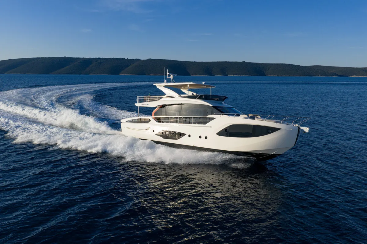 Absolute Yachts 70 FLY: White boat cruising at sea
