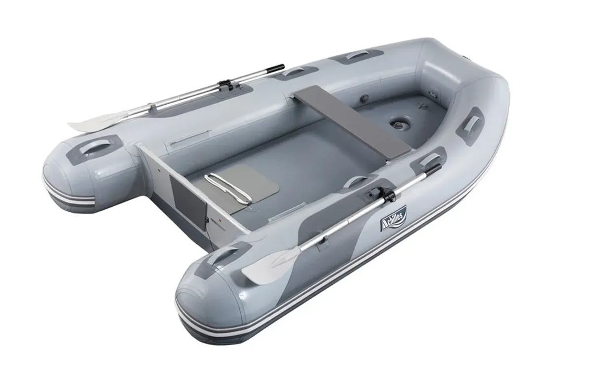 Achilles LSI-310E: Inflatable boat with paddles on a white background