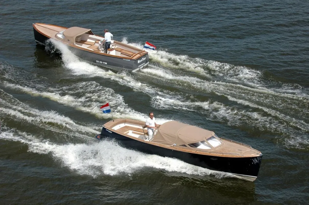 AdmiralsTender C28: Two boats cruising on the water