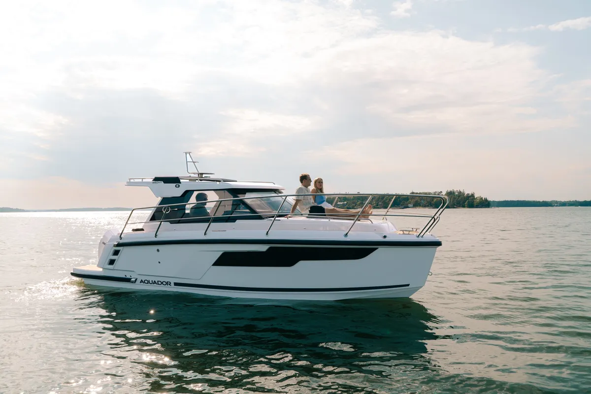 Aquador 250 HT: Boat cruising on water with passengers