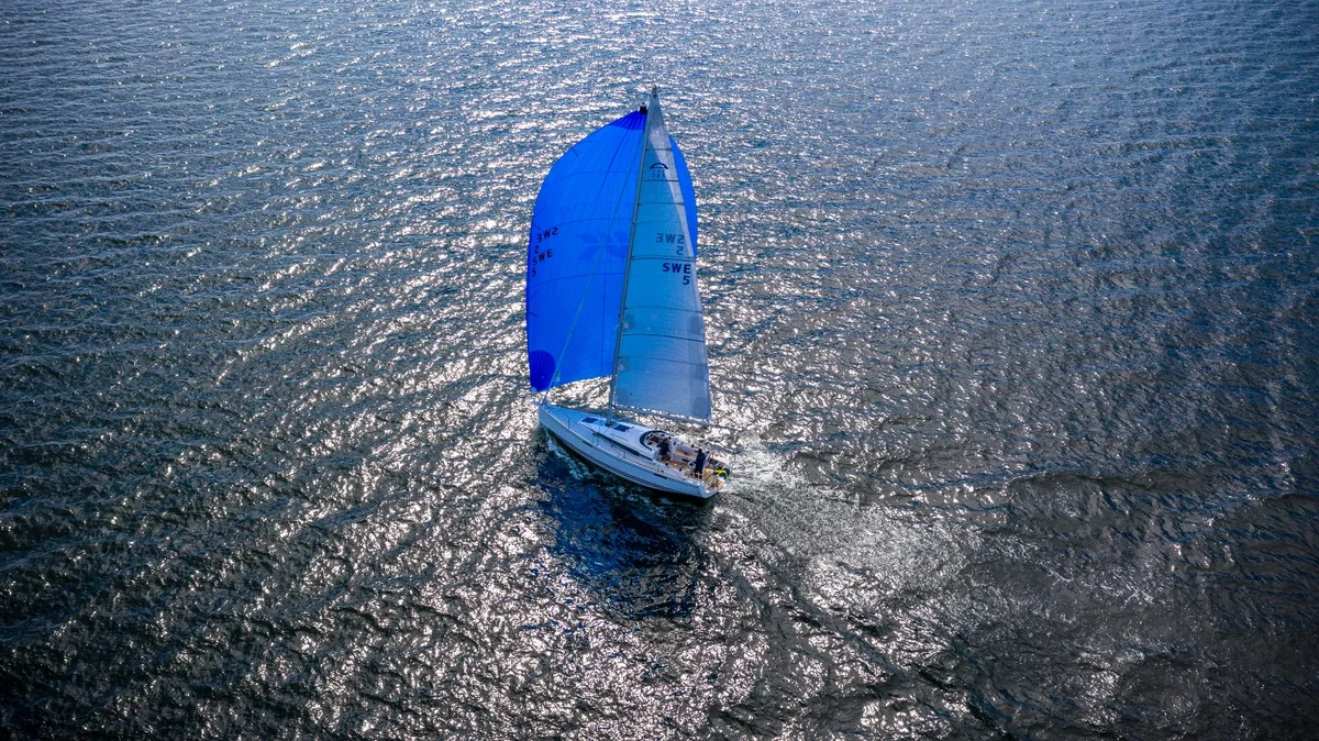 Arcona Yachts 385: Sailing boat with a blue spinnaker at sea