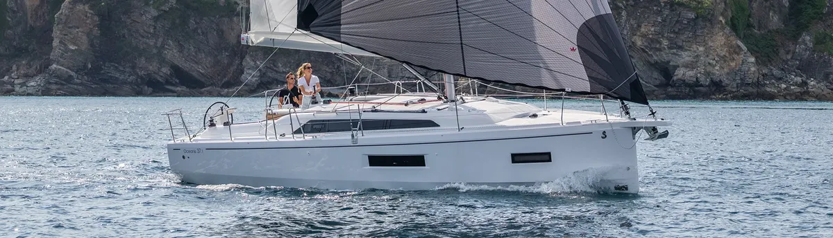 Beneteau Oceanis 37.1: Sailing boat sailing along the coastline