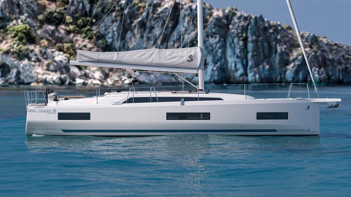 Beneteau Oceanis 42: Sailing boat moored near rocks