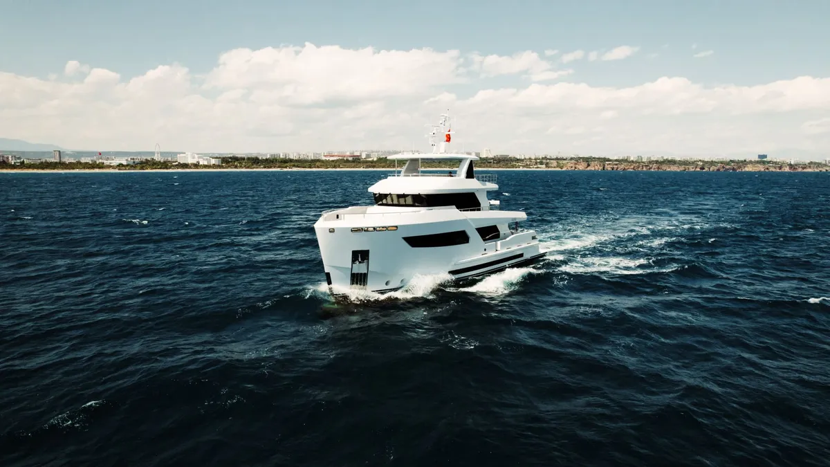 Bering Yachts B88: White yacht cruising at sea
