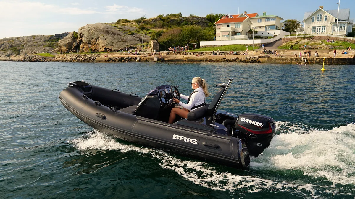 Brig Eagle 4: Rubber dinghy cruising off the coast