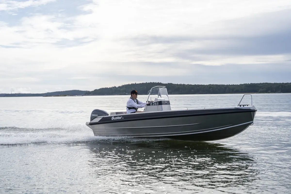 Buster Lcc: Boat cruising on water