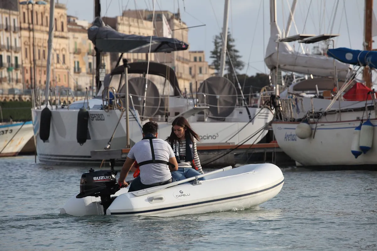 Capelli Tempest 275 Tender: Rubber dinghy with people in the harbour