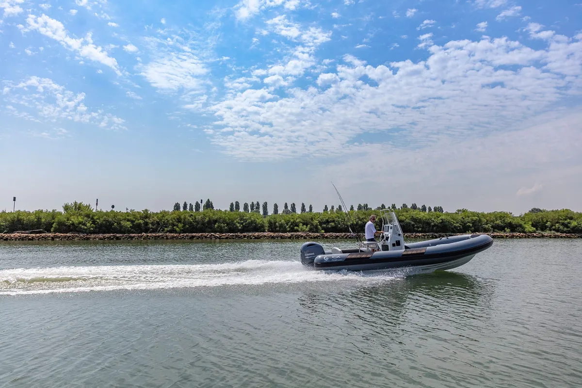 Capelli Tempest 700 Fishing: Rubber boat cruising on water