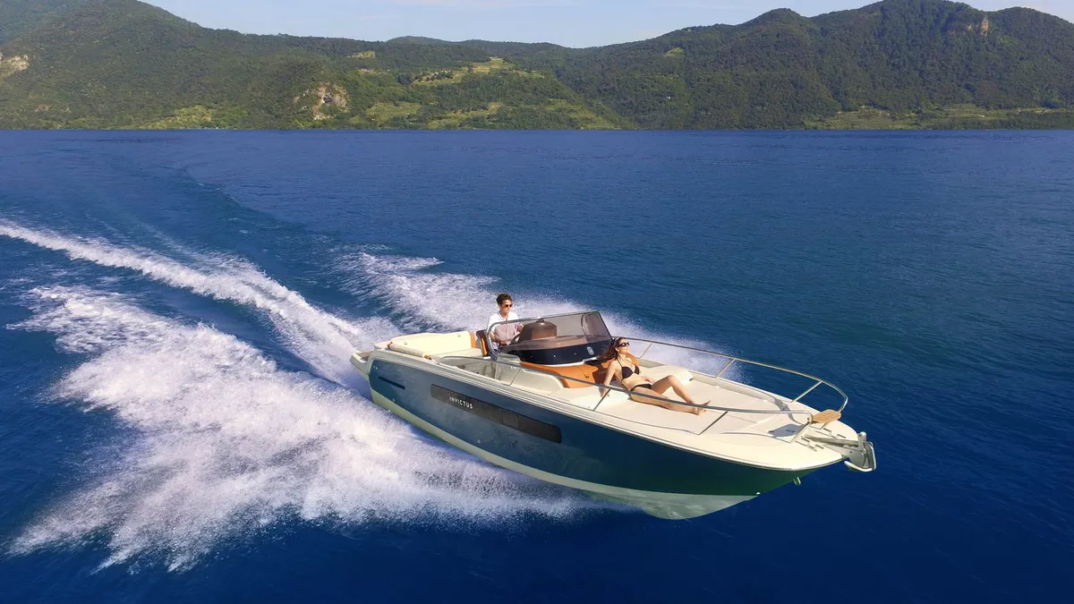 Capoforte Boats FX270: Boat cruising on a lake