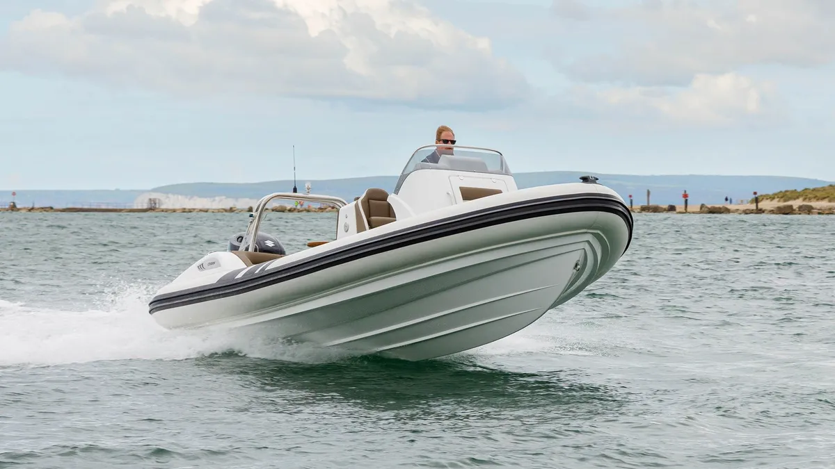 Cobra RIBs Nautique 7.0: White boat cruising at sea