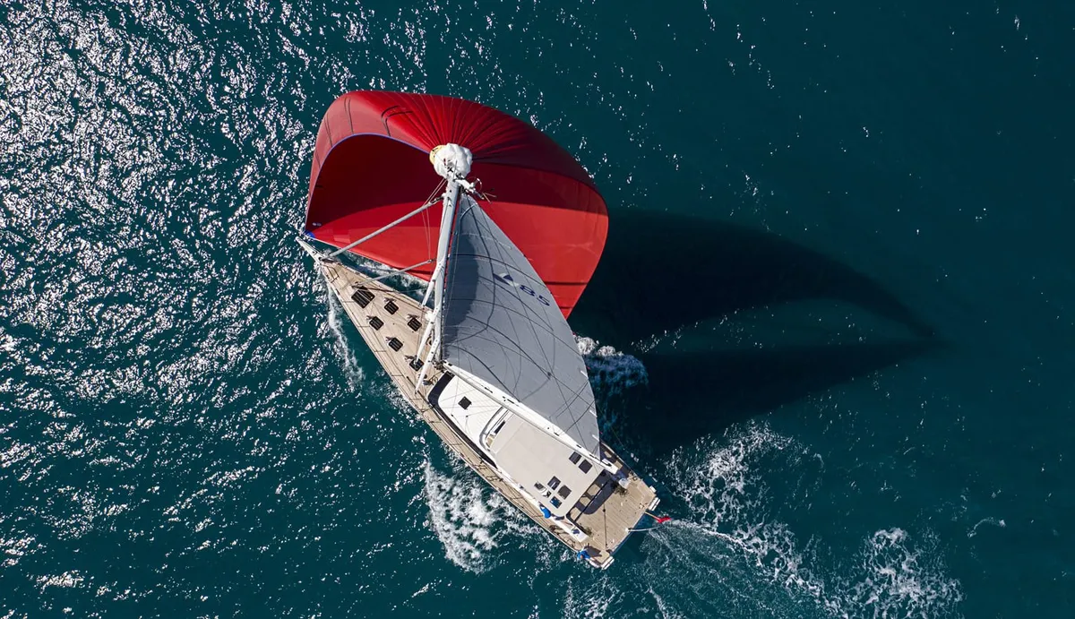 Contest Yachts 85CS: Sailing boat seen from above with a red spinnaker