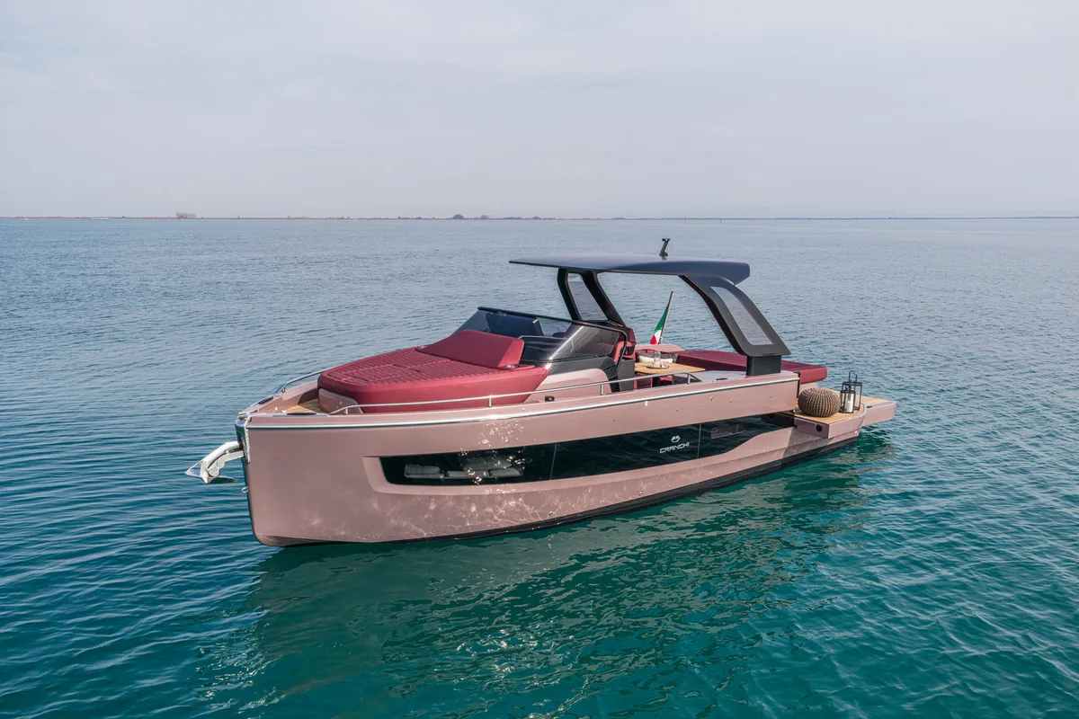 Cranchi A32 Luxury Tender: Pink motorboat at sea