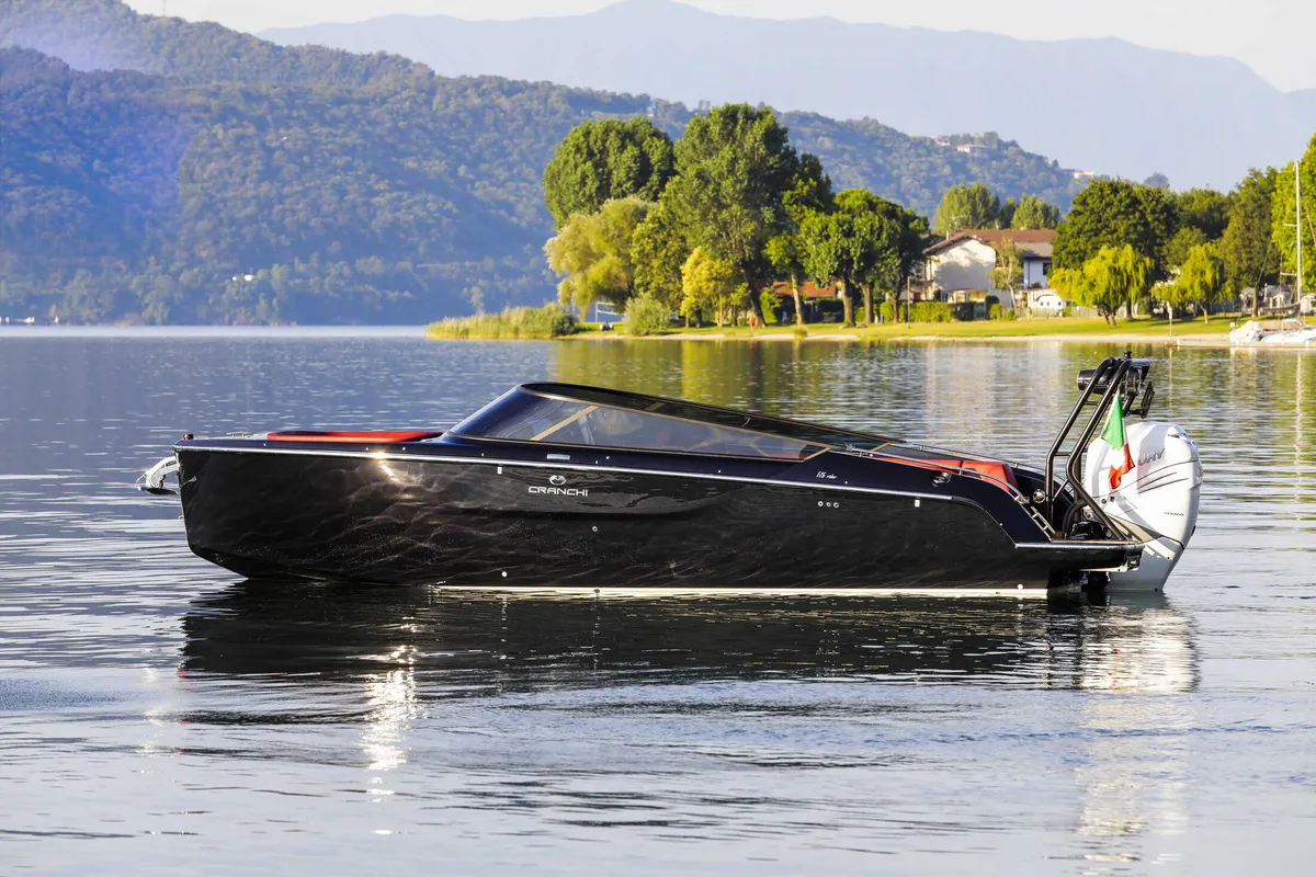 Cranchi E26 O/B: Black boat on a lake