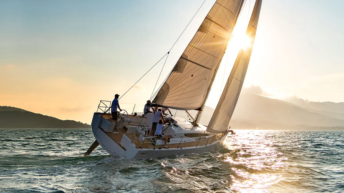 Elan Yachts E5: Sailing boat at sunset