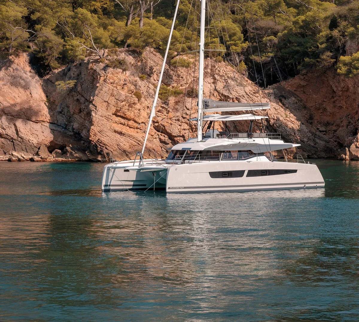 Fountaine Pajot FPY 59S: Catamaran at anchor near rocks