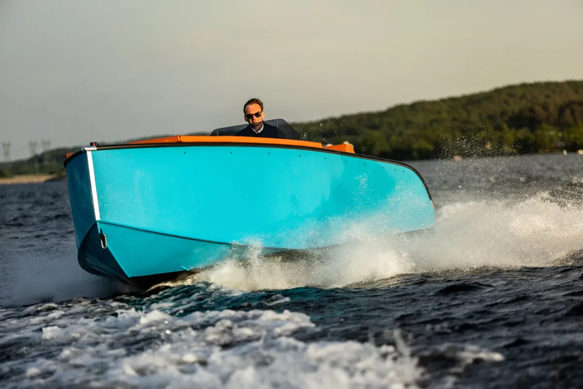 Futuro Boats ZX 22 IB: Boat cruising with a man at the helm