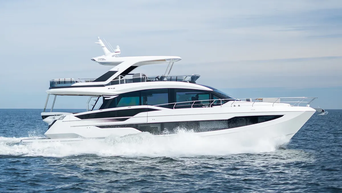 Galeon Yachts 640 FLY: White boat cruising at sea
