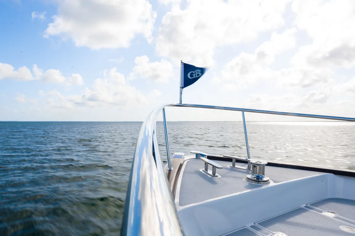 Grand Banks 73: Bow of a boat with a flag at sea
