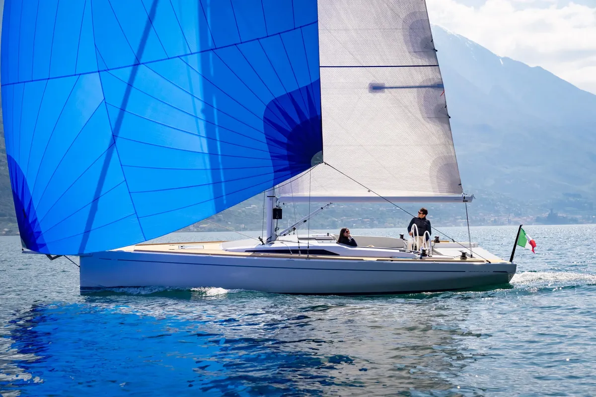 Grand Soleil GS Blue: Sailing boat with a blue spinnaker on a lake