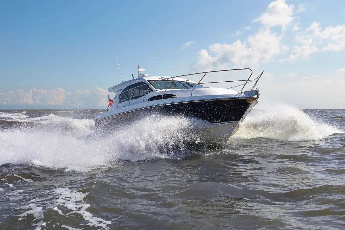Haines Marine 32 Offshore: Boat cruising through waves