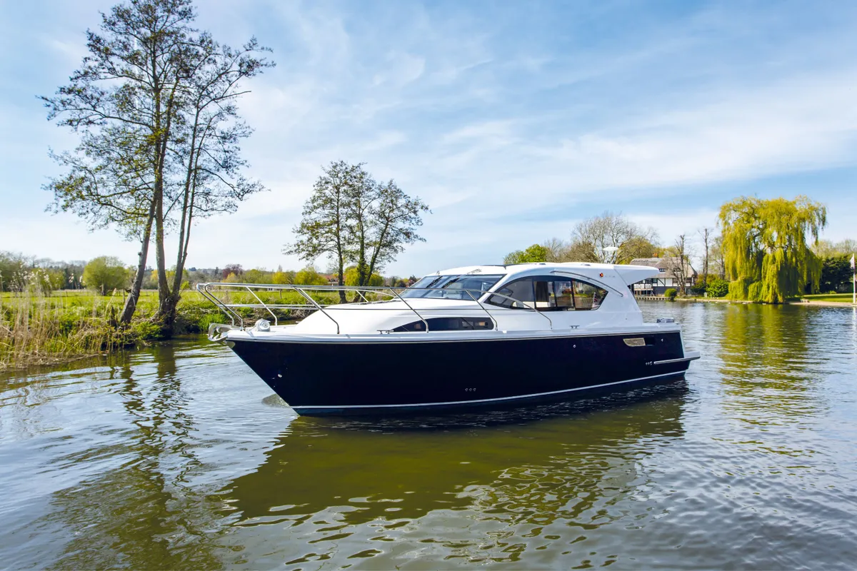 Haines Marine 36 Sedan: Motorboat cruising on a river