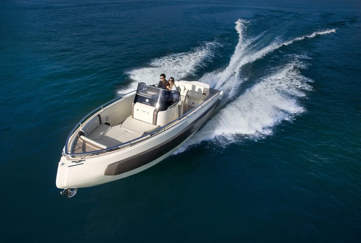 Invictus Yacht TT280: Boat cruising at sea with waves