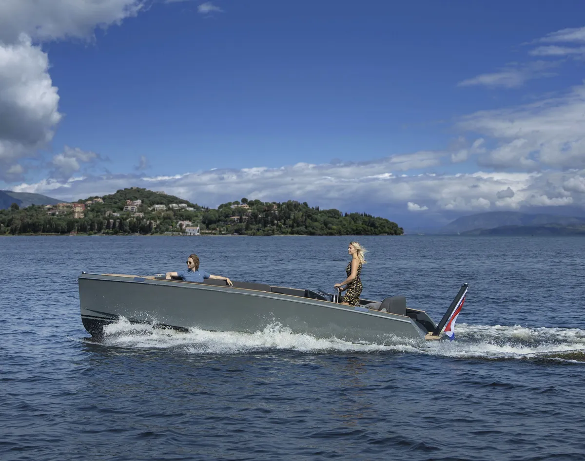 iSloep Rapida 666: Boat cruising at sea with the coast in the background