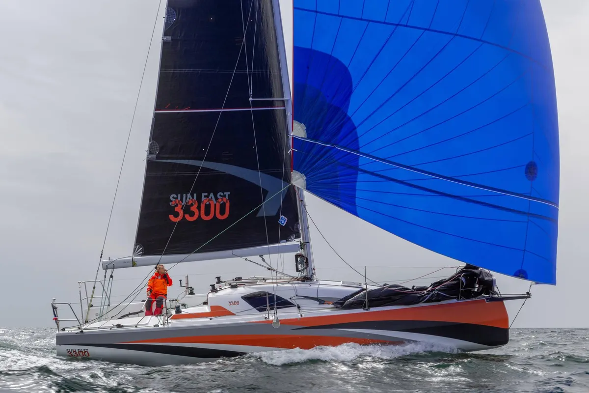 Jeanneau Sun Fast 3300: Sailing boat with a blue spinnaker at sea
