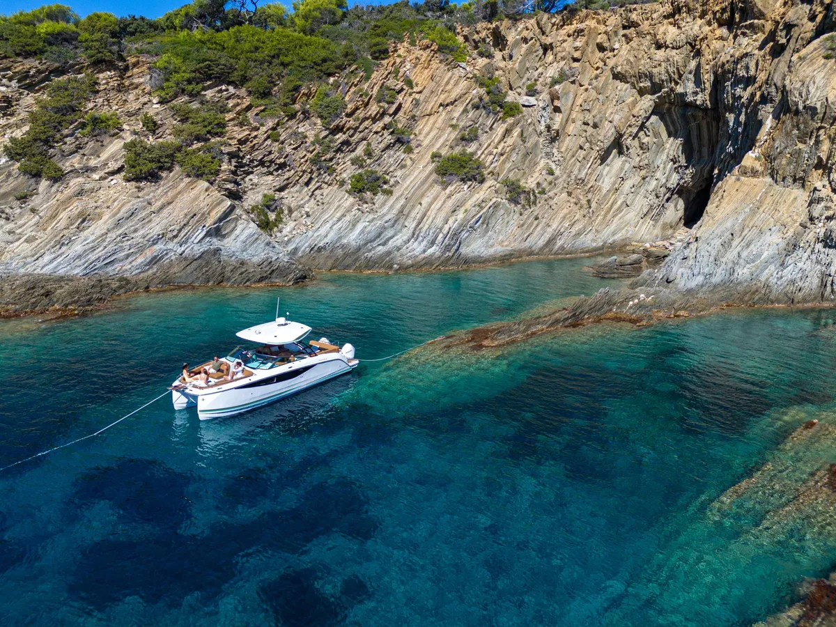 Jeanneau TH33: Boat moored in a rocky bay