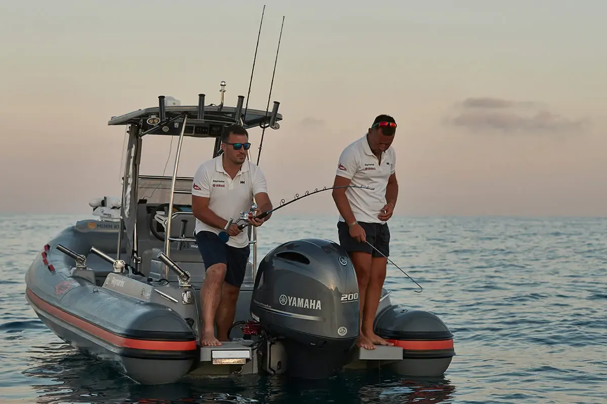 Joker Boat Barracuda 650: Men fishing from a boat