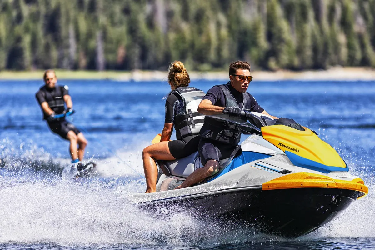 Kawasaki Jet Ski ST 160: Jet ski with a water skier on a lake