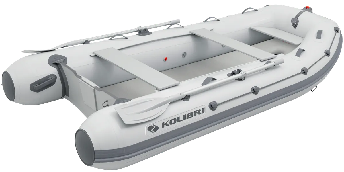 Kolibri KM-330DXL: Inflatable boat with paddle on a white background
