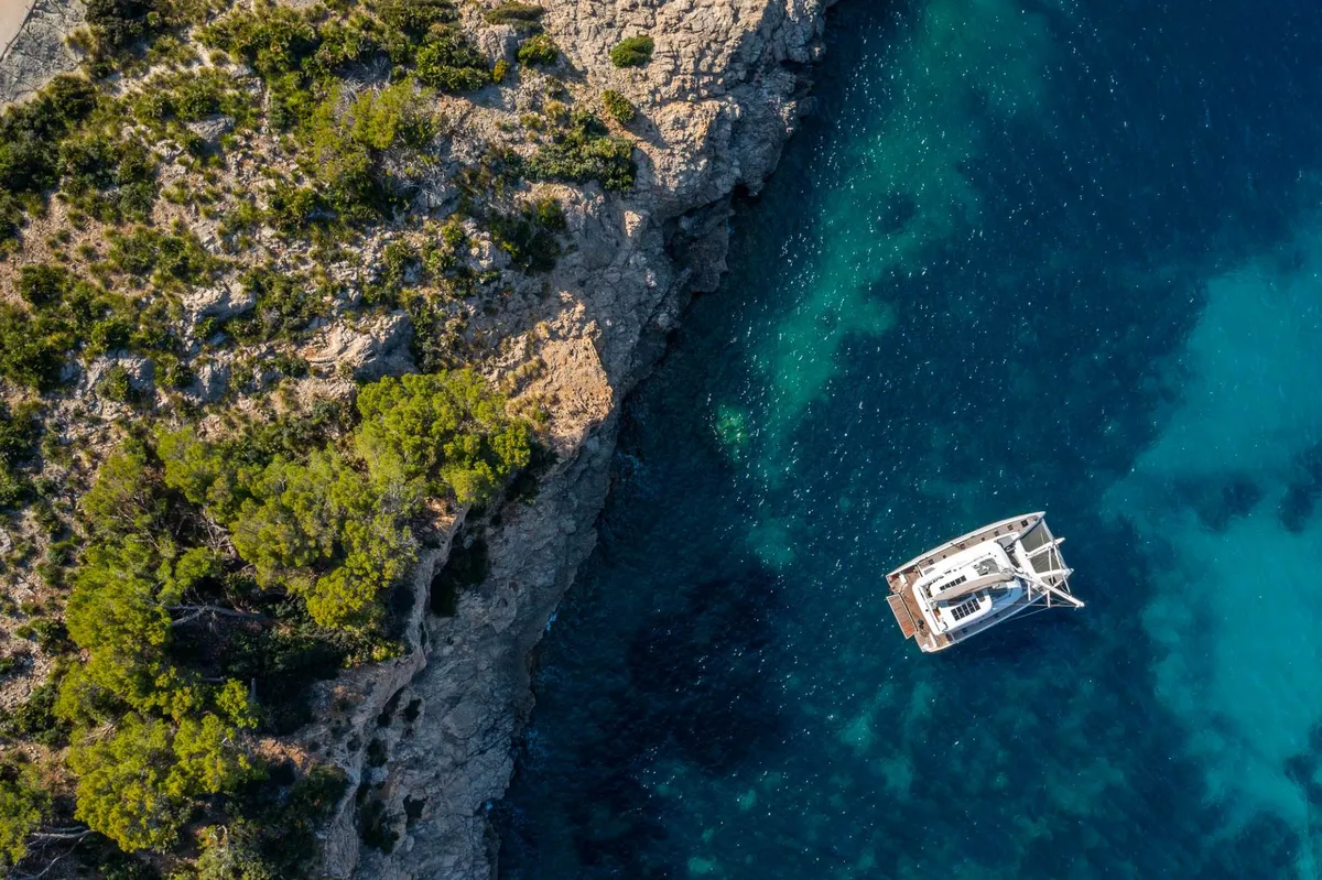 Lagoon 60: Catamaran at anchor off the coast