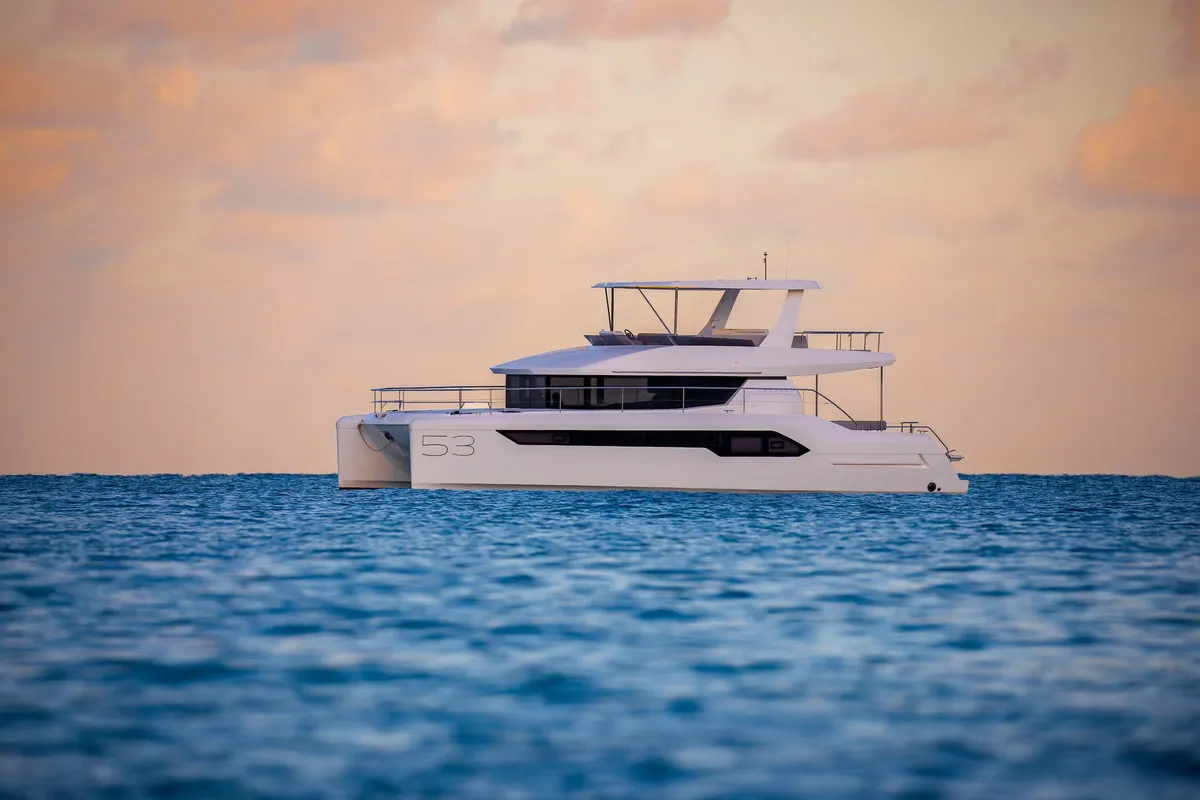 Leopard Catamarans 53PC: Catamaran sailing at sea at sunset