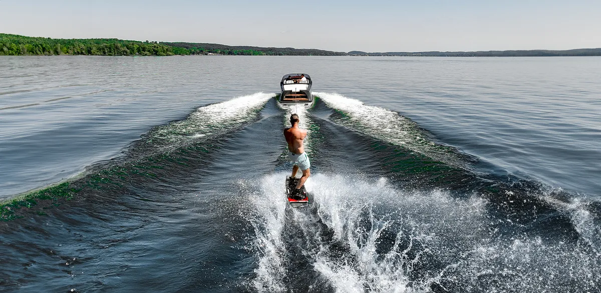 Marian Laguna 760: Man wakeboarding behind a boat