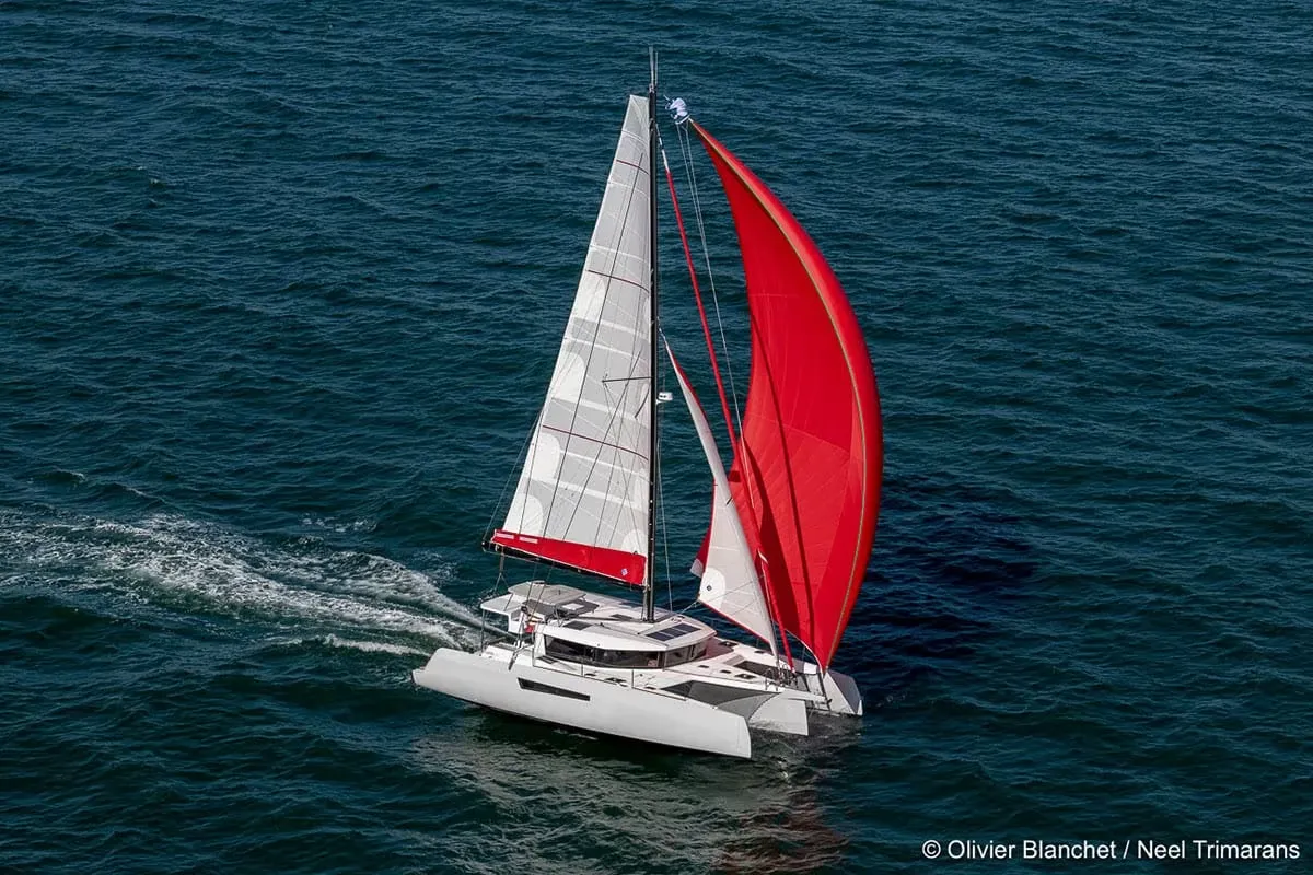 Neel Trimarans 47: Trimaran with red sails at sea