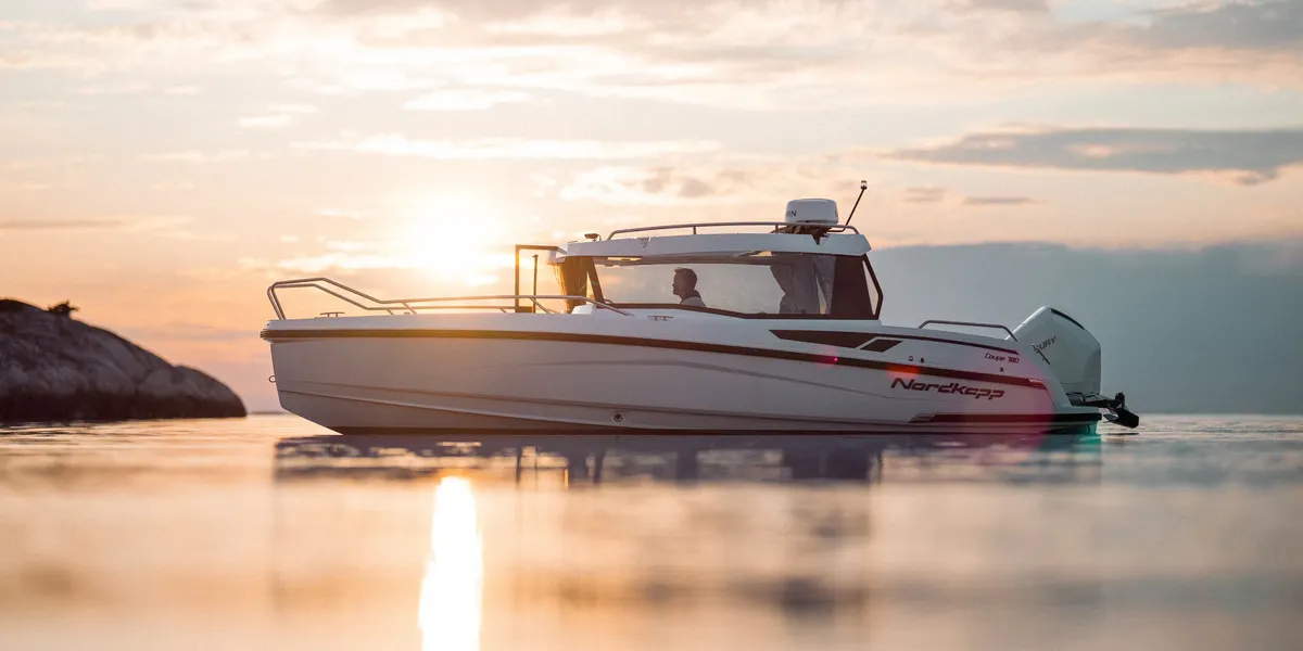 Nordkapp Boats Coupe 780: Boat cruising at sunset