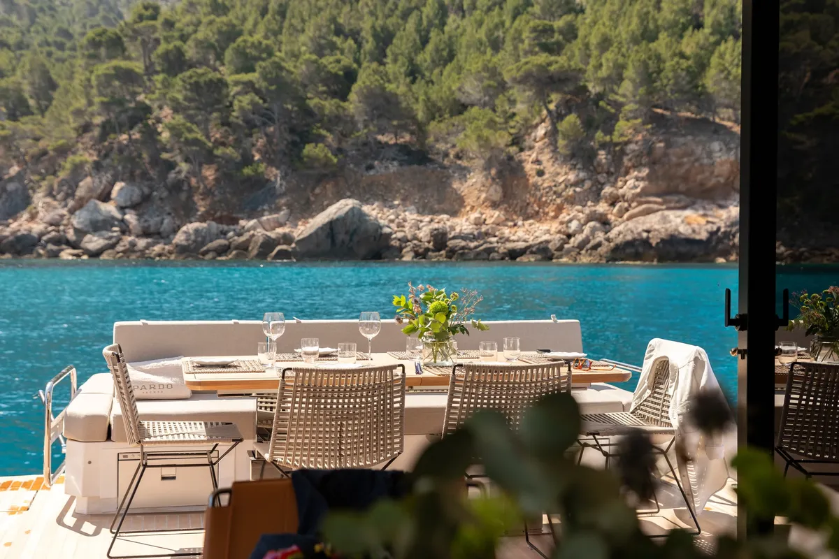 Pardo Yachts E72: Dining table on the aft deck of a boat