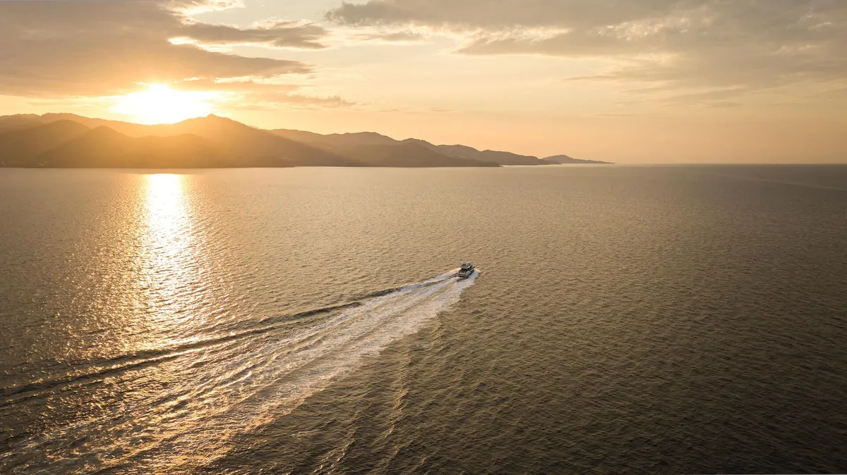 Prestige Yachts F5.7: Boat cruising at sunset