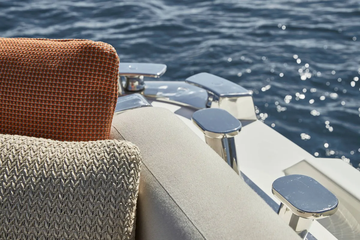 Prestige Yachts X70: Seat cushions and chrome boat hooks