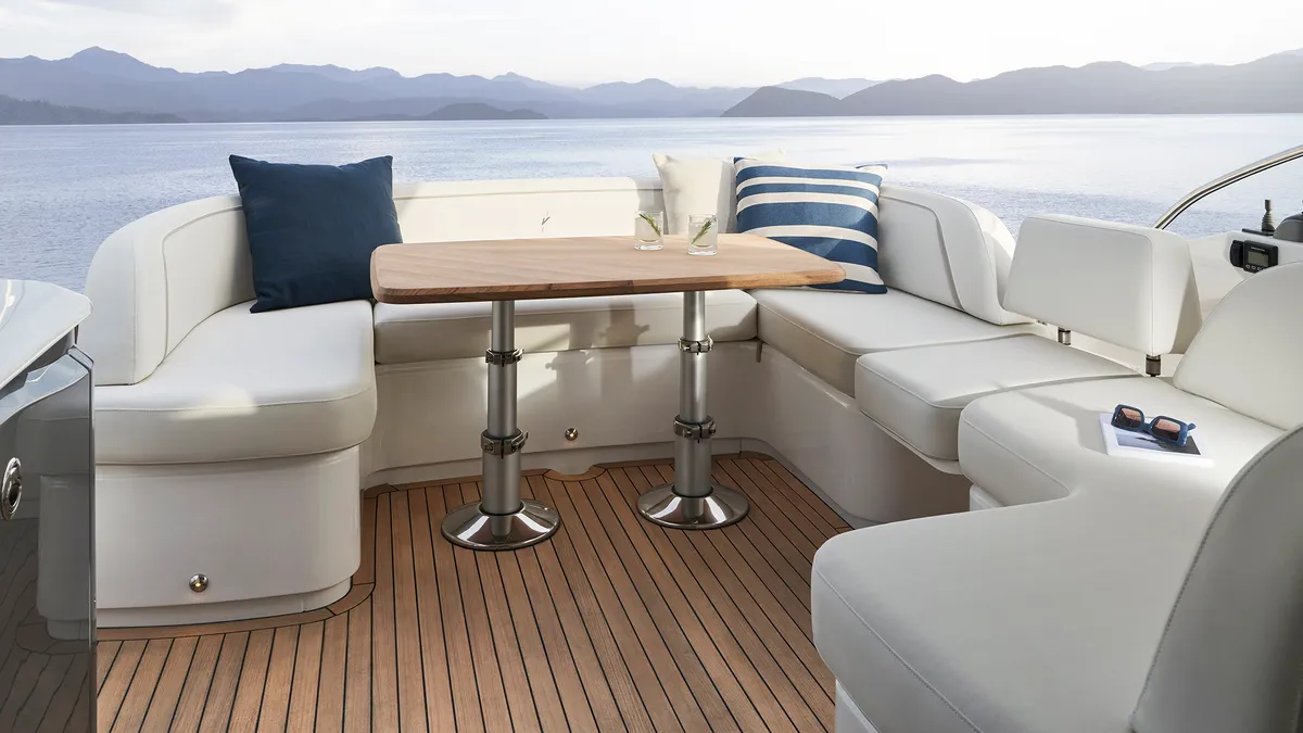 Princess V50: Seating area with table on deck