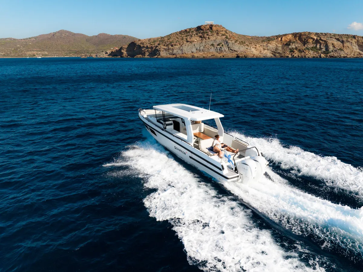 Quarken Boats 35 Grand Tourer: Boat cruising at sea near the coast