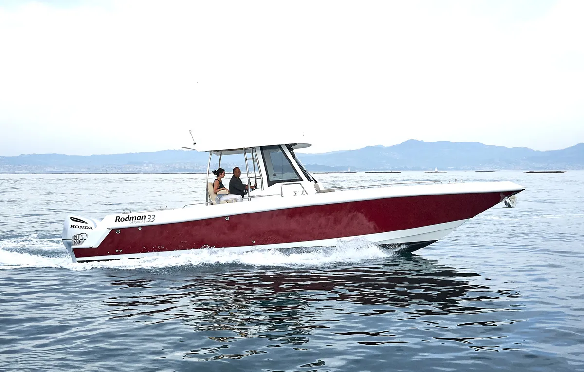 Rodman 33 Offshore: Red boat cruising at sea