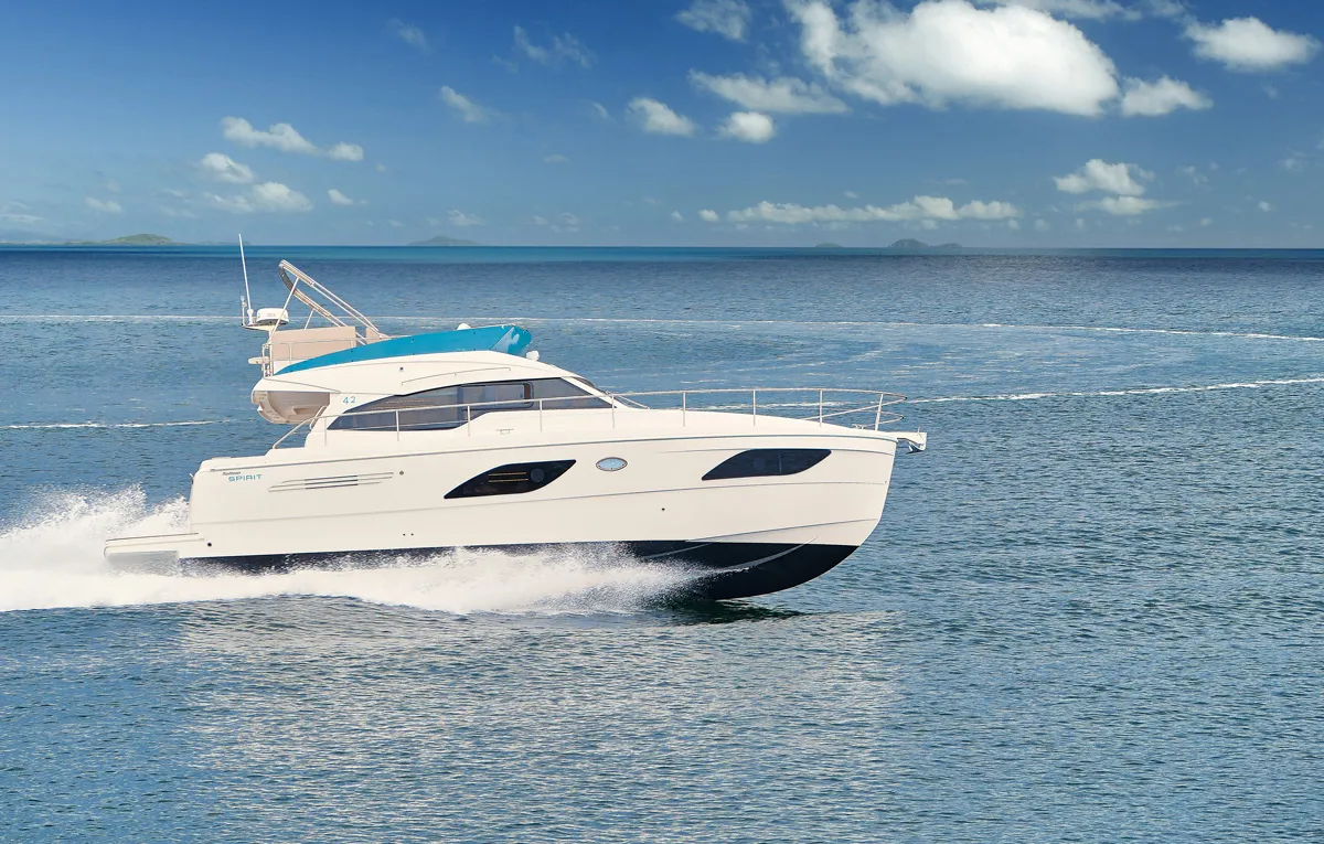 Rodman Spirit 42 Fly Bridge: A white motorboat speeds across the sea