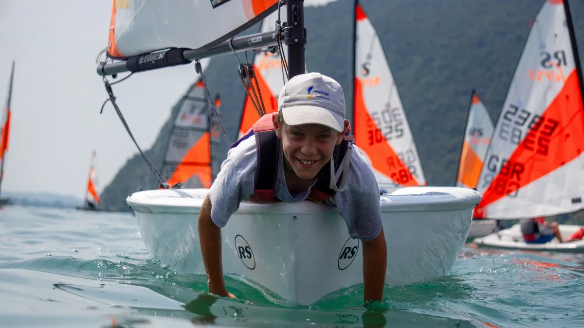RS Sailing Tera: Boy leaning on a sailing boat