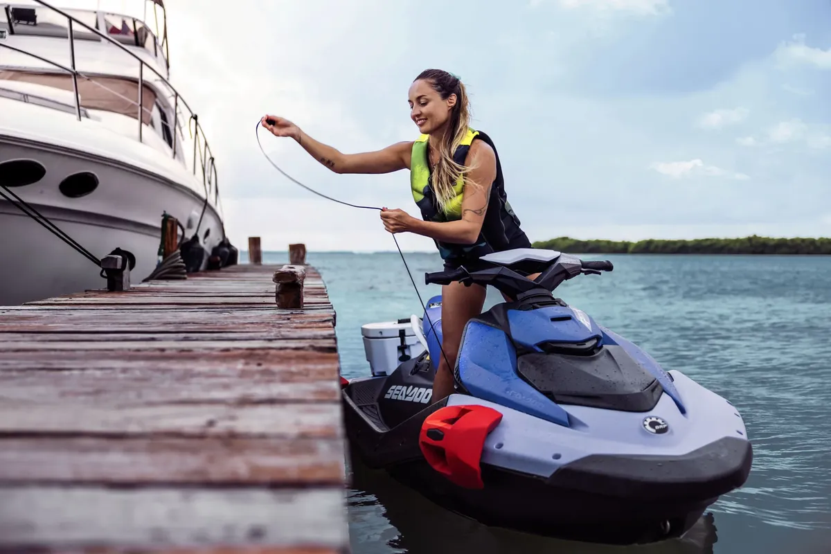 Sea-Doo Spark: Woman on a jet ski by a jetty
