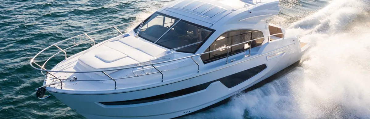 Sessa Marine C42: White motorboat cruising at sea